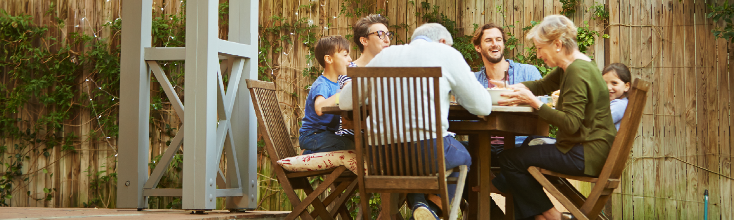 Family eating dinner outdoors